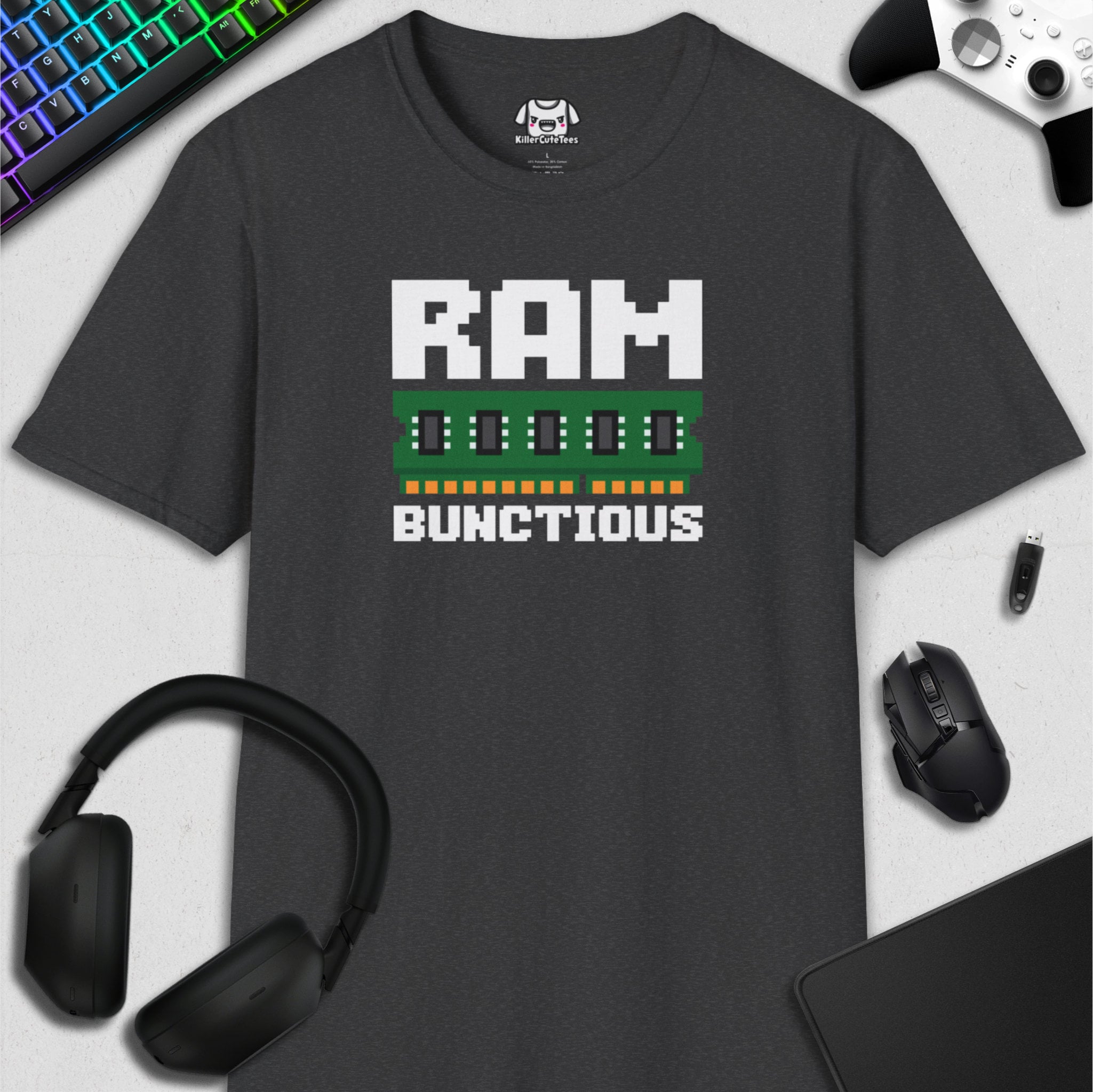 Gray t-shirt with 'RAM BUNCTIOUS' design on a desk with computer accessories.